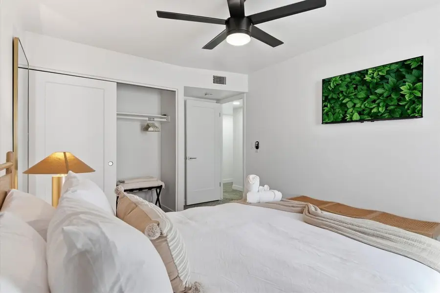 Queen bed and nightstands in the second bedroom at Hideaway