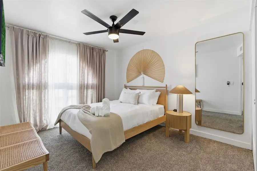 Second bedroom at Hideaway with a queen bed and a smart TV