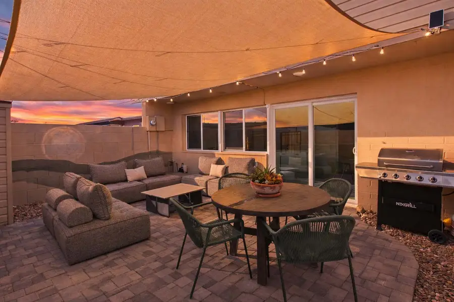 Gas grill and lounge chairs on the private patio at Hideaway