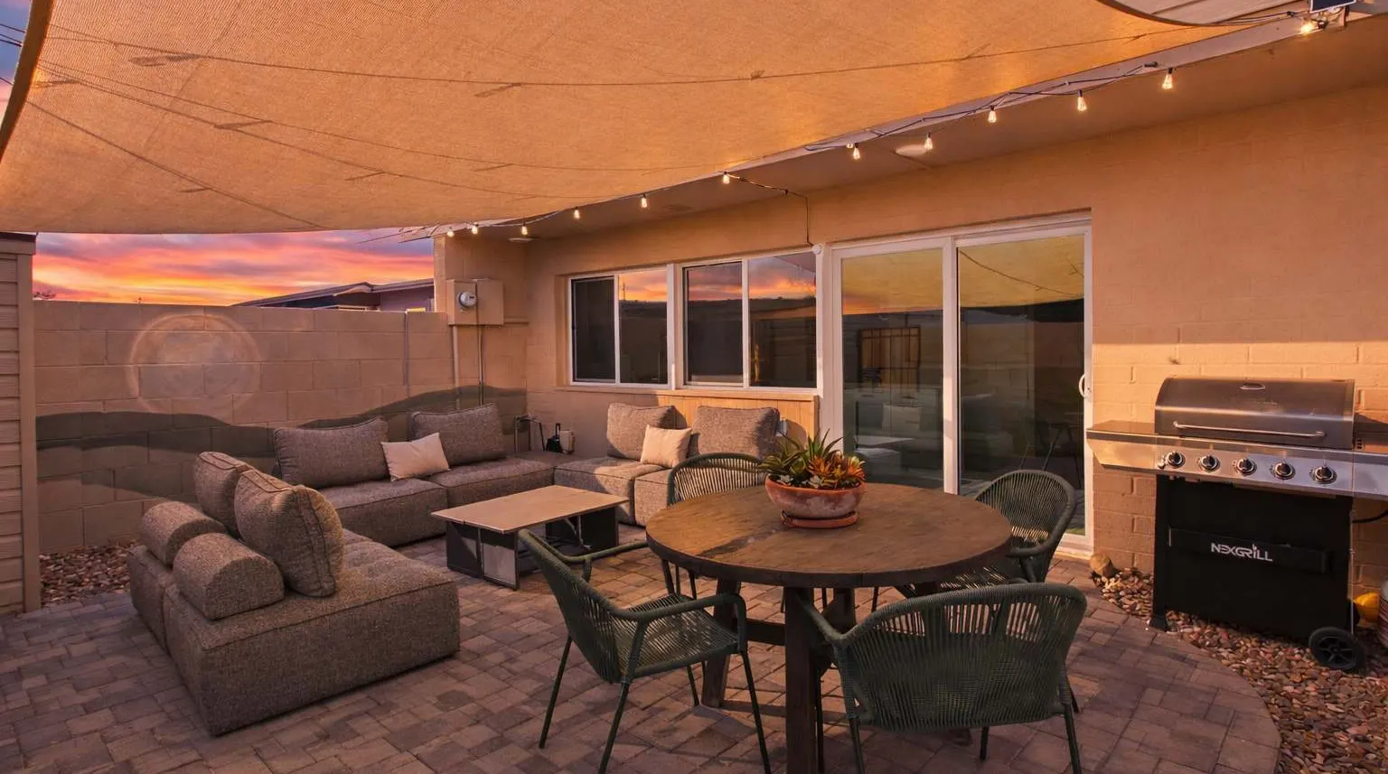 Gas grill and lounge chairs on the private patio at Hideaway
