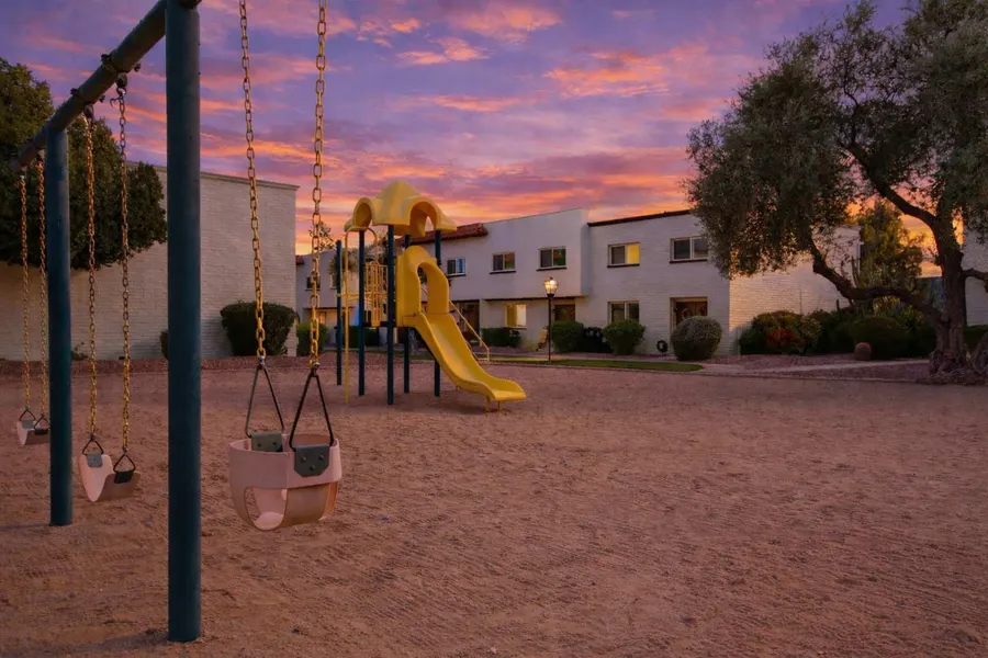 Community playground on the lawn at Casa Granada East near Hideaway
