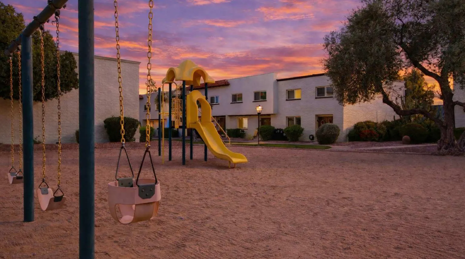Community playground on the lawn at Casa Granada East near Hideaway
