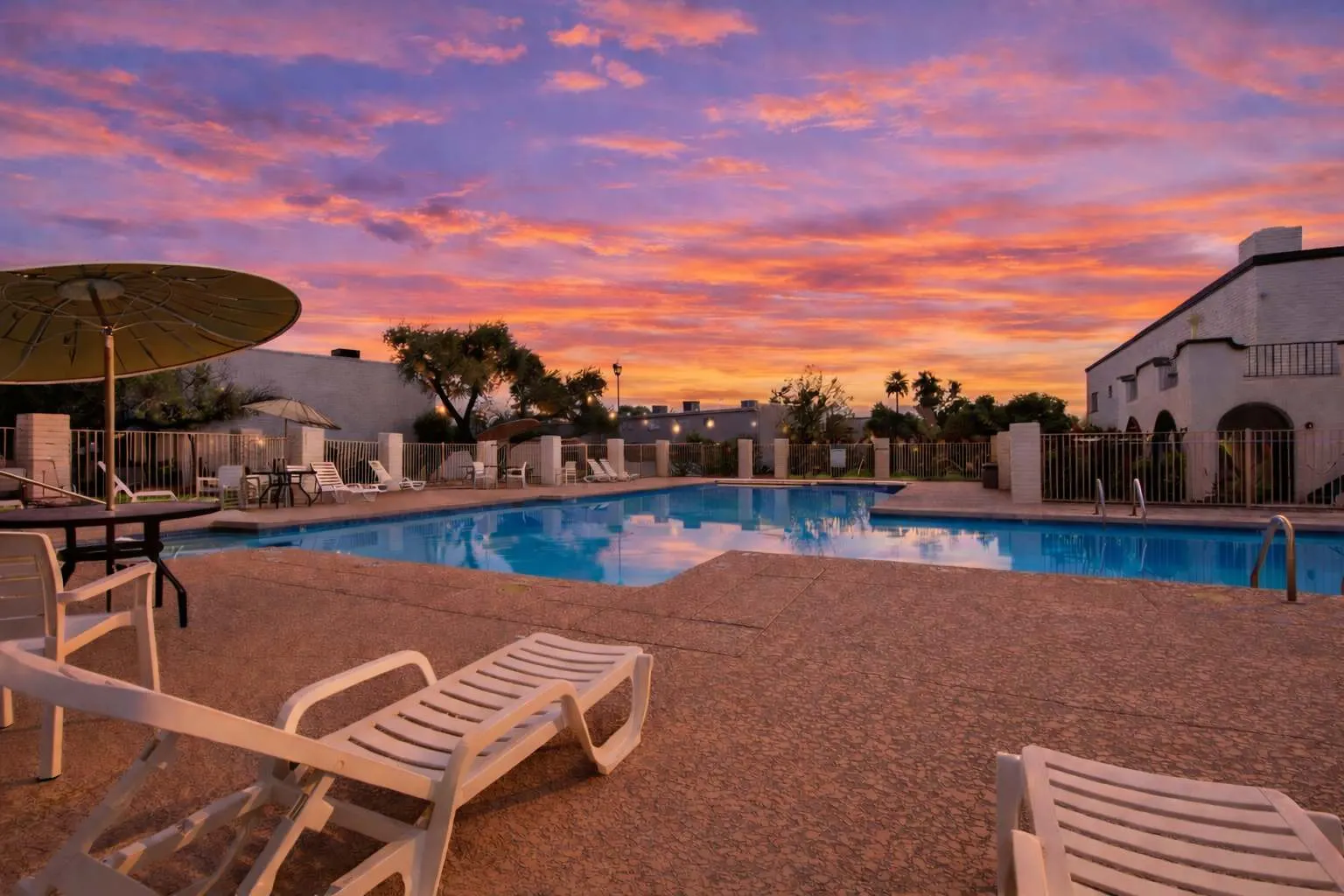 Casa Granada East community pool with lounge chairs and a cabana, a short walk from Hideaway