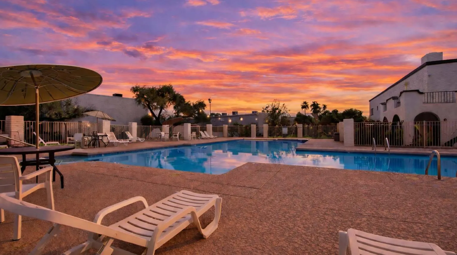 Casa Granada East community pool with lounge chairs and a cabana, a short walk from Hideaway