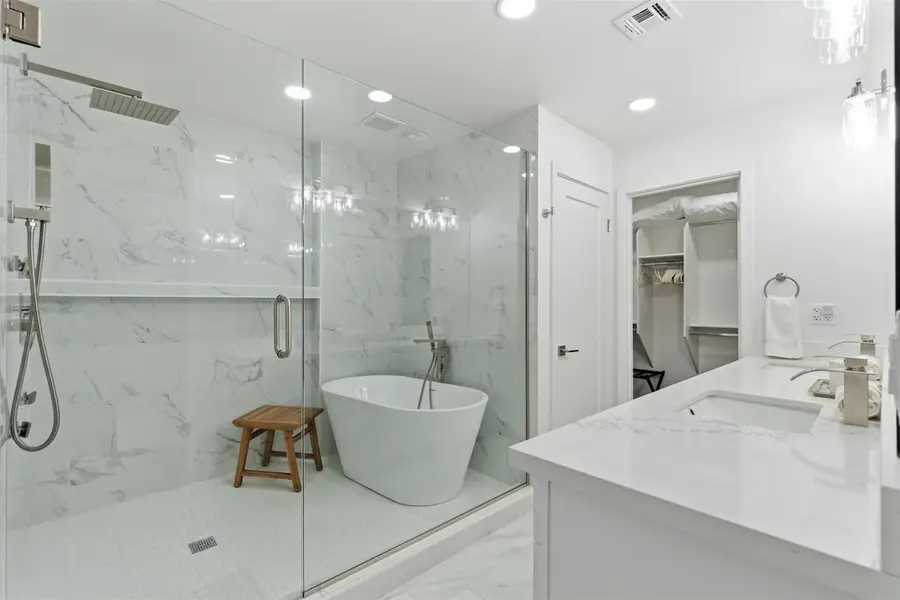 Walk-in shower and soaking tub in the primary bathroom at Hideaway