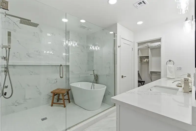 Walk-in shower and soaking tub in the primary bathroom at Hideaway