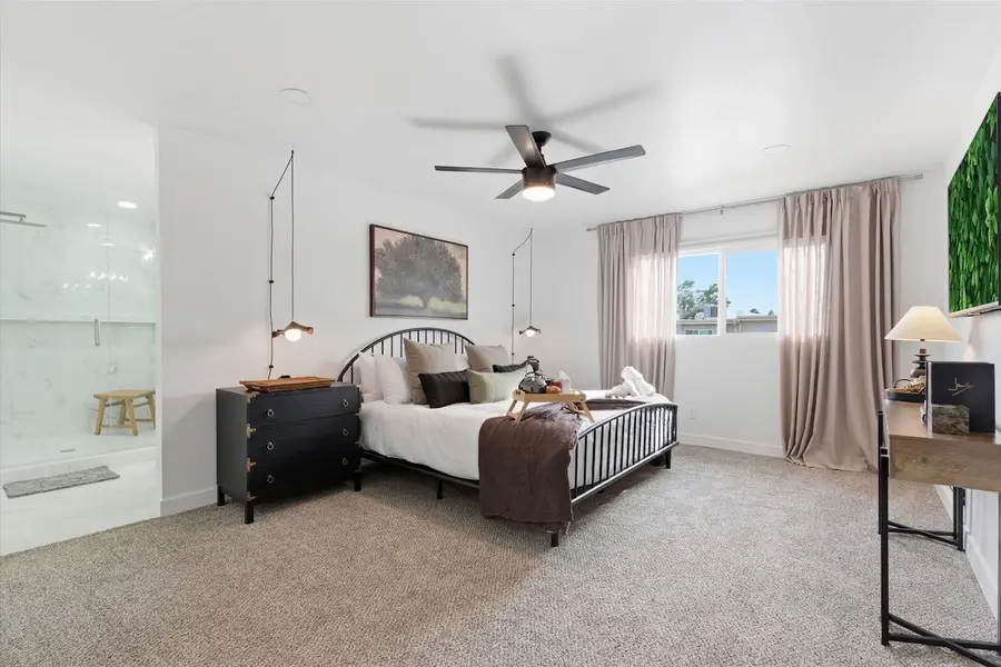 Primary bedroom at Hideaway with a king bed, smart TV and doors to the en-suite bathroom